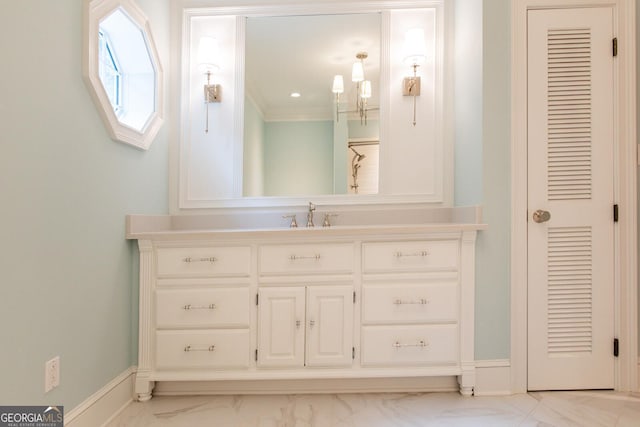 bathroom featuring vanity, baseboards, marble finish floor, and a closet