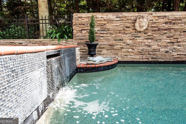 details with a pool and fence