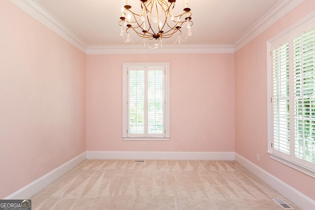 empty room with visible vents, carpet floors, a healthy amount of sunlight, and ornamental molding
