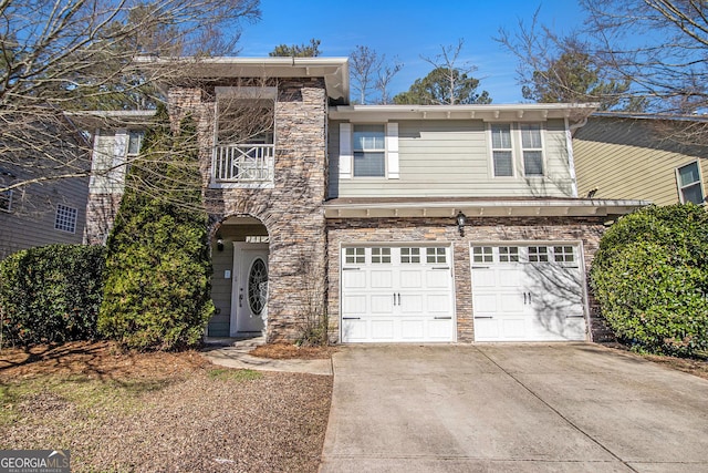 4319 Alysheba Dr, Fairburn, GA 30213 - view of front of home with concrete driveway, a garage, a balcony, and stone siding