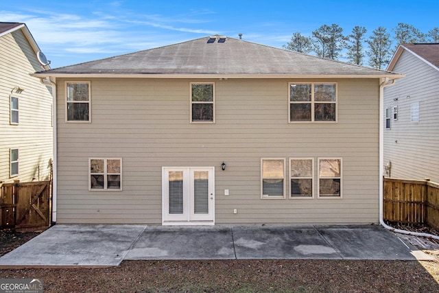 4319 Alysheba Dr, Fairburn, GA 30213 - rear view of property featuring a fenced backyard, roof with shingles, and a patio