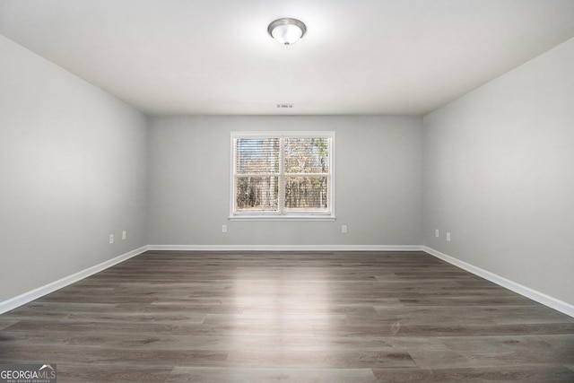 4319 Alysheba Dr, Fairburn, GA 30213 - unfurnished room with dark wood-style flooring and baseboards