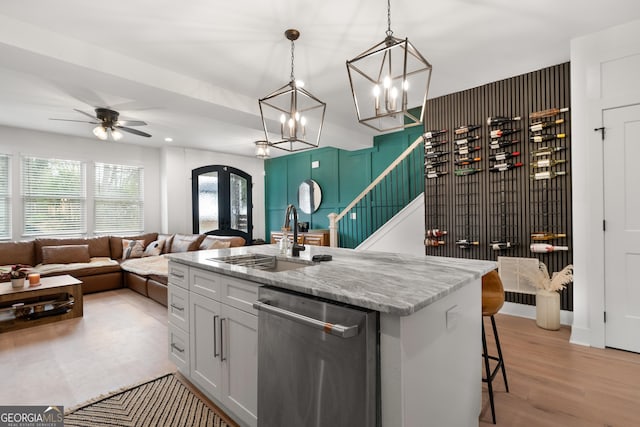 1290 Westboro Dr SW, Atlanta, GA 30310 - kitchen featuring open floor plan, dishwasher, light stone counters, ceiling fan with notable chandelier, and a sink