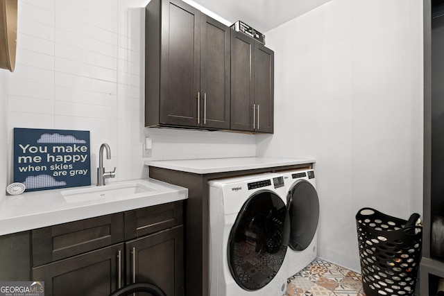 1290 Westboro Dr SW, Atlanta, GA 30310 - clothes washing area with a sink, cabinet space, tile patterned flooring, and washer and clothes dryer