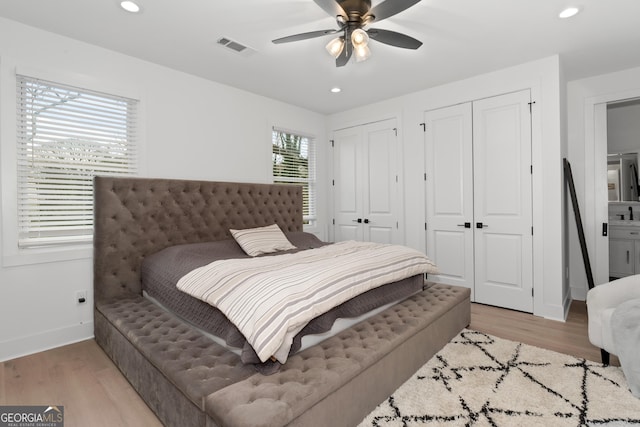 1290 Westboro Dr SW, Atlanta, GA 30310 - bedroom featuring recessed lighting, light wood-style flooring, and two closets