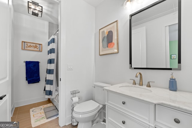 1290 Westboro Dr SW, Atlanta, GA 30310 - bathroom featuring baseboards, toilet, and vanity