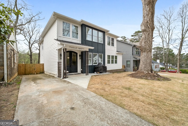 1290 Westboro Dr SW, Atlanta, GA 30310 - view of front of house with french doors, a front yard, and fence