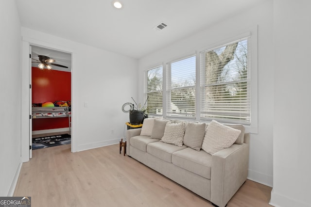 1290 Westboro Dr SW, Atlanta, GA 30310 - living area featuring visible vents, baseboards, ceiling fan, and light wood finished floors