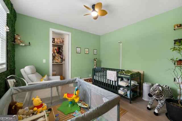 1290 Westboro Dr SW, Atlanta, GA 30310 - bedroom featuring ceiling fan, a crib, and wood finished floors
