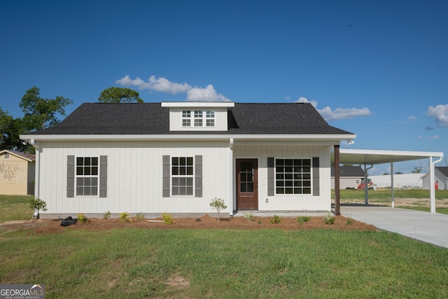 42 Walton Way, Hazlehurst, GA 31539 - view of front of house featuring a front lawn, concrete driveway, and an attached carport
