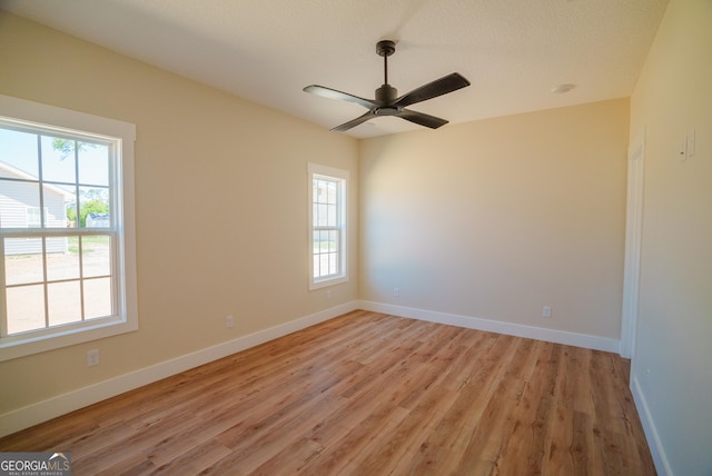 42 Walton Way, Hazlehurst, GA 31539 - spare room with healthy amount of natural light, light wood finished floors, and ceiling fan
