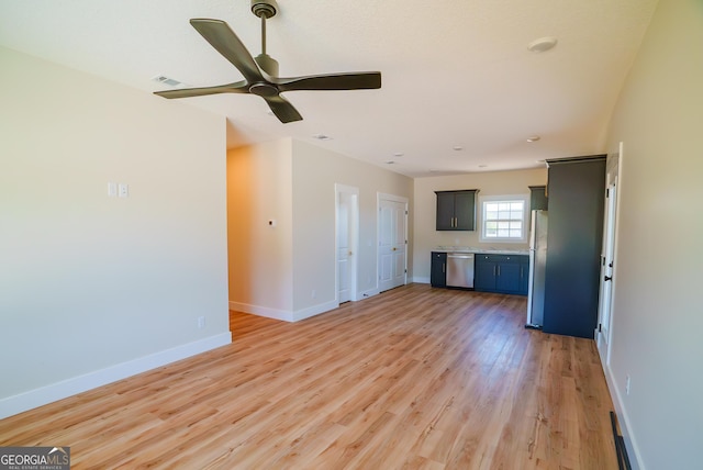 42 Walton Way, Hazlehurst, GA 31539 - unfurnished living room with light wood finished floors and a ceiling fan