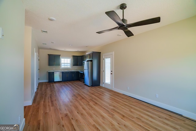 42 Walton Way, Hazlehurst, GA 31539 - unfurnished living room with light wood-type flooring and ceiling fan