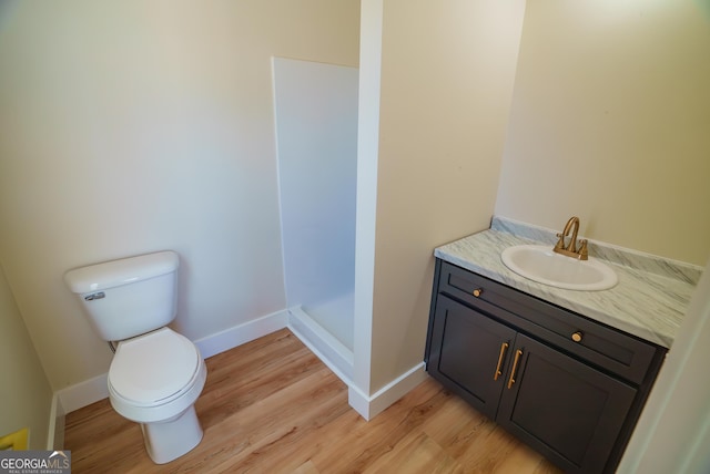 42 Walton Way, Hazlehurst, GA 31539 - full bathroom with wood finished floors, vanity, and a shower