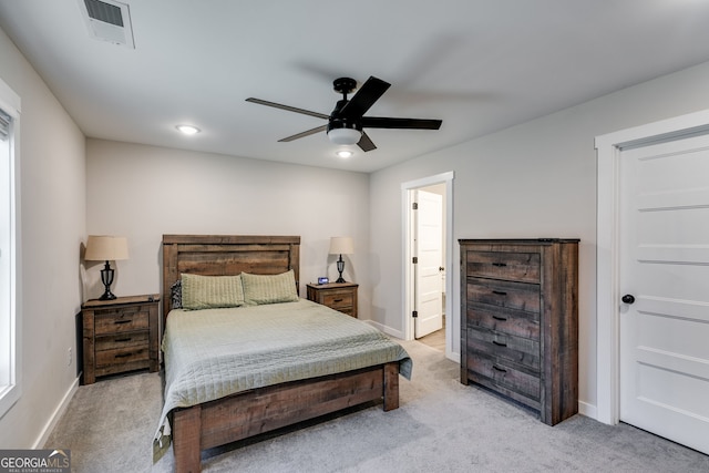 132 Pinnacle Way, Carrollton, GA 30117 - bedroom featuring visible vents, ensuite bathroom, a ceiling fan, baseboards, and light colored carpet
