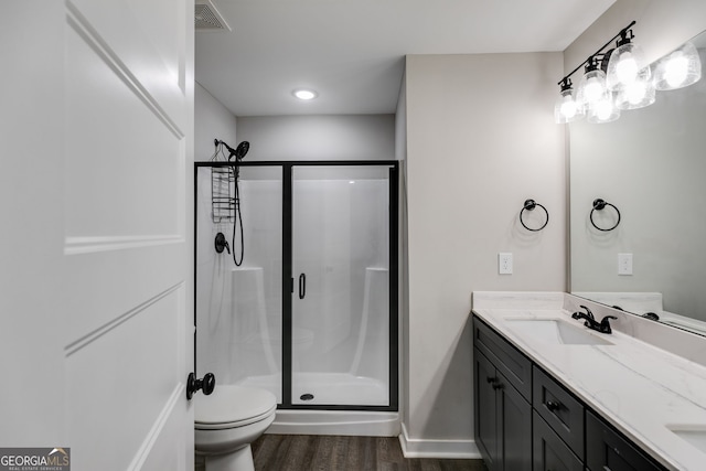 132 Pinnacle Way, Carrollton, GA 30117 - bathroom featuring visible vents, a shower stall, toilet, and a sink