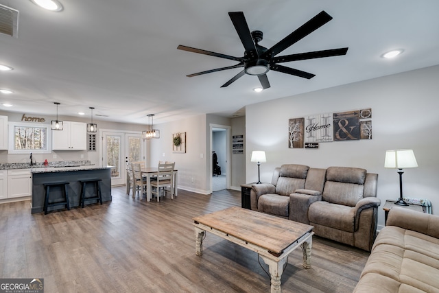 132 Pinnacle Way, Carrollton, GA 30117 - living room featuring wood finished floors, recessed lighting, a ceiling fan, and visible vents