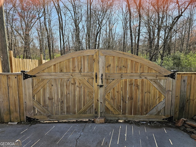 view of gate with fence