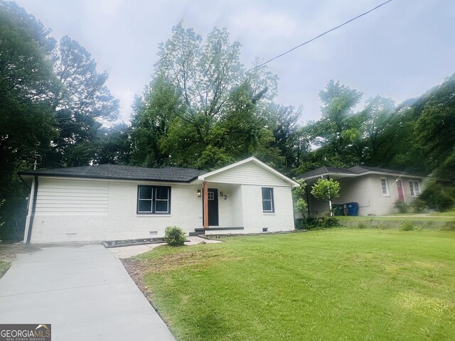 single story home with brick siding, a front yard, and crawl space