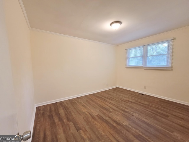 1151 N Beddingfield Dr, Macon, GA 31206 - empty room featuring dark wood-style floors and crown molding