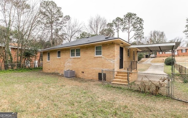 1151 N Beddingfield Dr, Macon, GA 31206 - back of property with an attached carport, brick siding, crawl space, driveway, and a gate