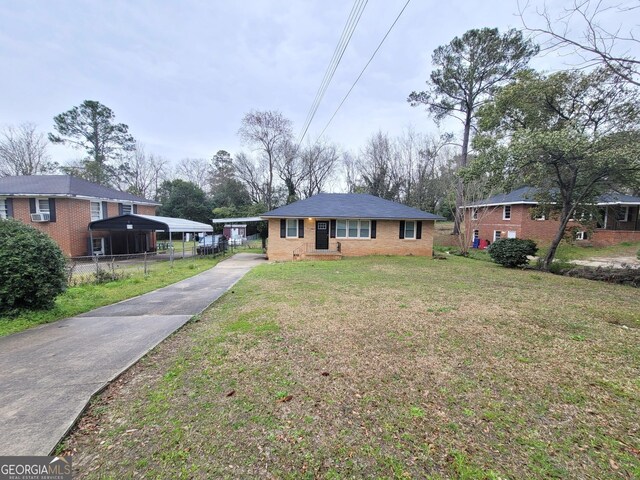 1151 N Beddingfield Dr, Macon, GA 31206 - view of front of property featuring concrete driveway, a carport, and brick siding