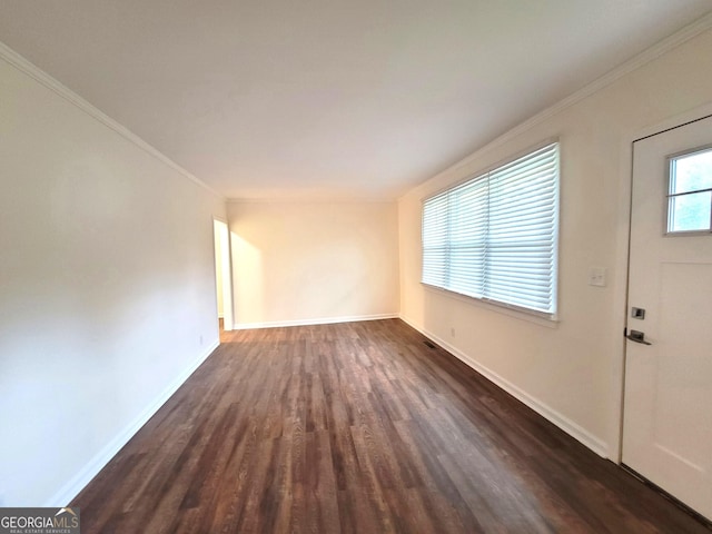 1151 N Beddingfield Dr, Macon, GA 31206 - unfurnished living room with dark wood finished floors and crown molding