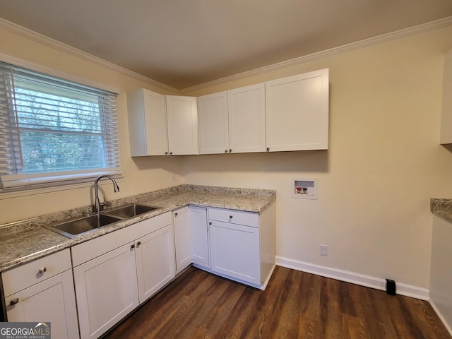 1151 N Beddingfield Dr, Macon, GA 31206 - laundry area with washer hookup, dark wood-type flooring, ornamental molding, and cabinet space