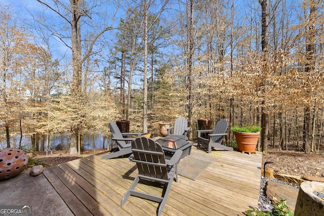 wooden deck with a water view
