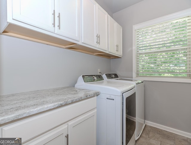 1351 Ashbury Park Dr, Hoschton, GA 30548 - washroom with washer and dryer, cabinet space, and baseboards