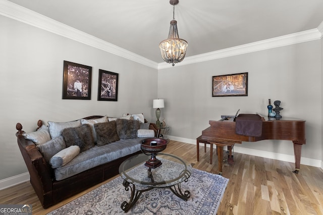 1351 Ashbury Park Dr, Hoschton, GA 30548 - living area featuring crown molding, a chandelier, and wood finished floors