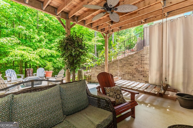 1351 Ashbury Park Dr, Hoschton, GA 30548 - view of patio featuring stairway, ceiling fan, and a fire pit