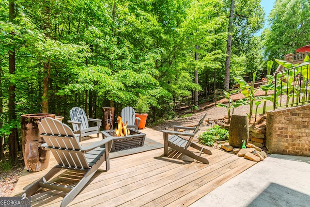 1351 Ashbury Park Dr, Hoschton, GA 30548 - wooden deck featuring a fire pit