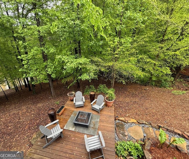 view of yard with a fire pit
