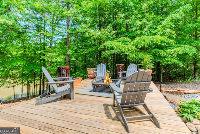 1351 Ashbury Park Dr, Hoschton, GA 30548 - wooden terrace featuring a fire pit
