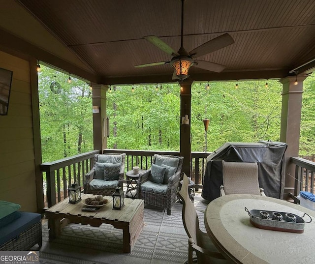 deck with ceiling fan and an outdoor hangout area