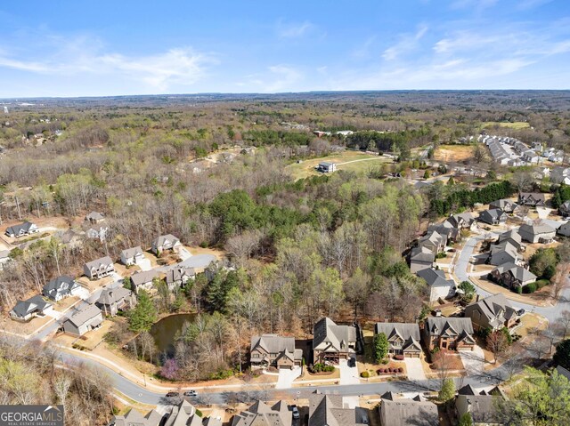 bird's eye view with a residential view and a view of trees