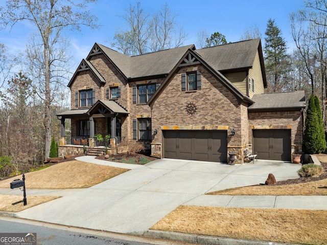 craftsman-style house featuring a garage, covered porch, stone siding, roof with shingles, and driveway
