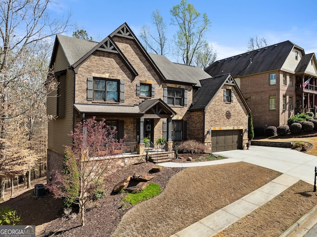 view of front of home featuring a garage, covered porch, concrete driveway, and brick siding