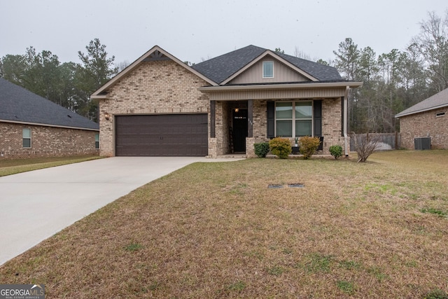 view of front of home featuring brick siding, driveway, an attached garage, and a front lawn