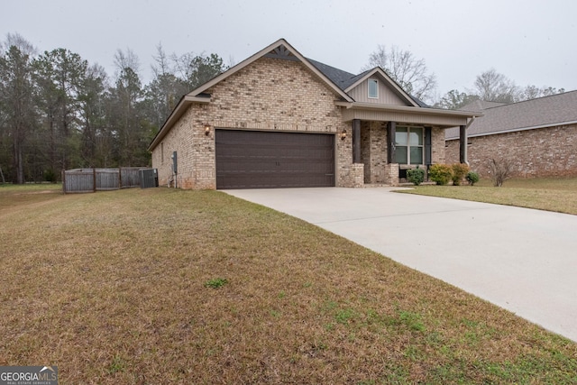 view of front of home with brick siding, an attached garage, concrete driveway, and a front yard