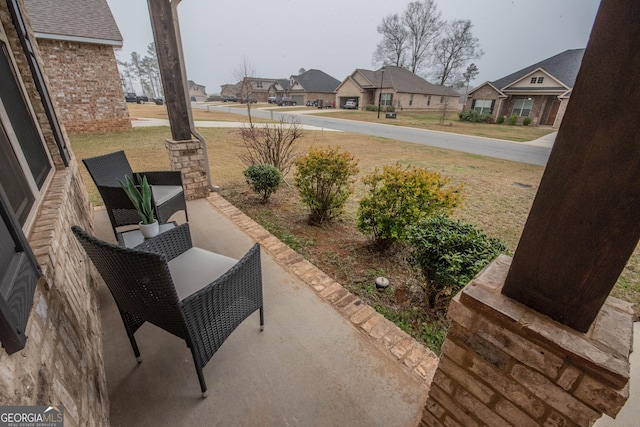 view of patio / terrace with a residential view