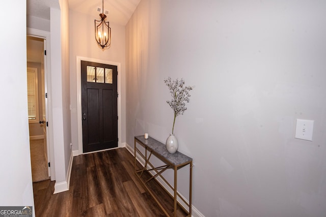 entryway with baseboards, a chandelier, and dark wood-style flooring