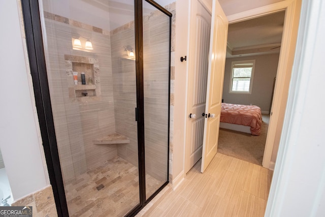 full bath featuring ensuite bath and a shower stall