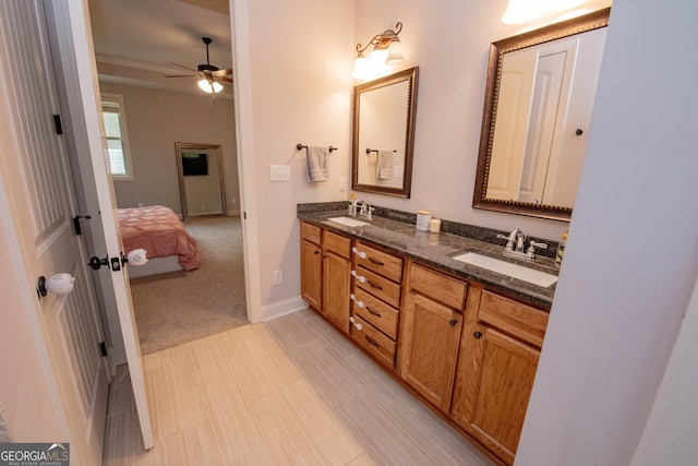 ensuite bathroom with a sink, ensuite bathroom, double vanity, and a ceiling fan