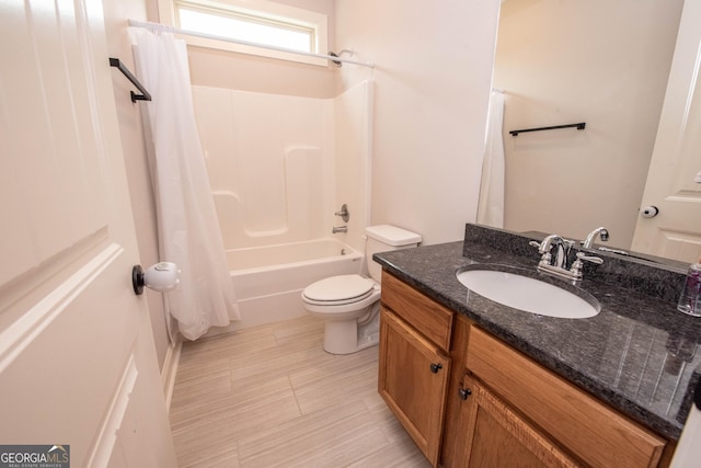 full bathroom featuring shower / tub combo, toilet, and vanity