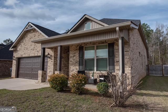 view of front of home featuring a porch, concrete driveway, a shingled roof, a garage, and brick siding