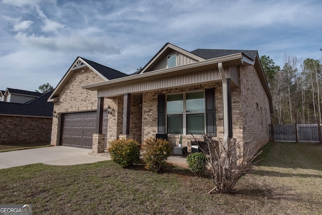 view of front of home with brick siding, covered porch, an attached garage, and driveway