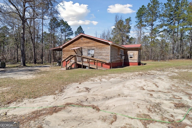 97 Meadow Rd, Swainsboro, GA 30401 - view of side of home with metal roof