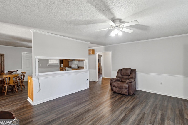97 Meadow Rd, Swainsboro, GA 30401 - sitting room with ornamental molding, wainscoting, dark wood-style floors, a textured ceiling, and a ceiling fan